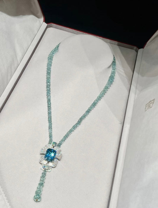 Cartier High Jewelry Necklace - Main stone: 37-carat aquamarine; two opals; chain beads: topaz.