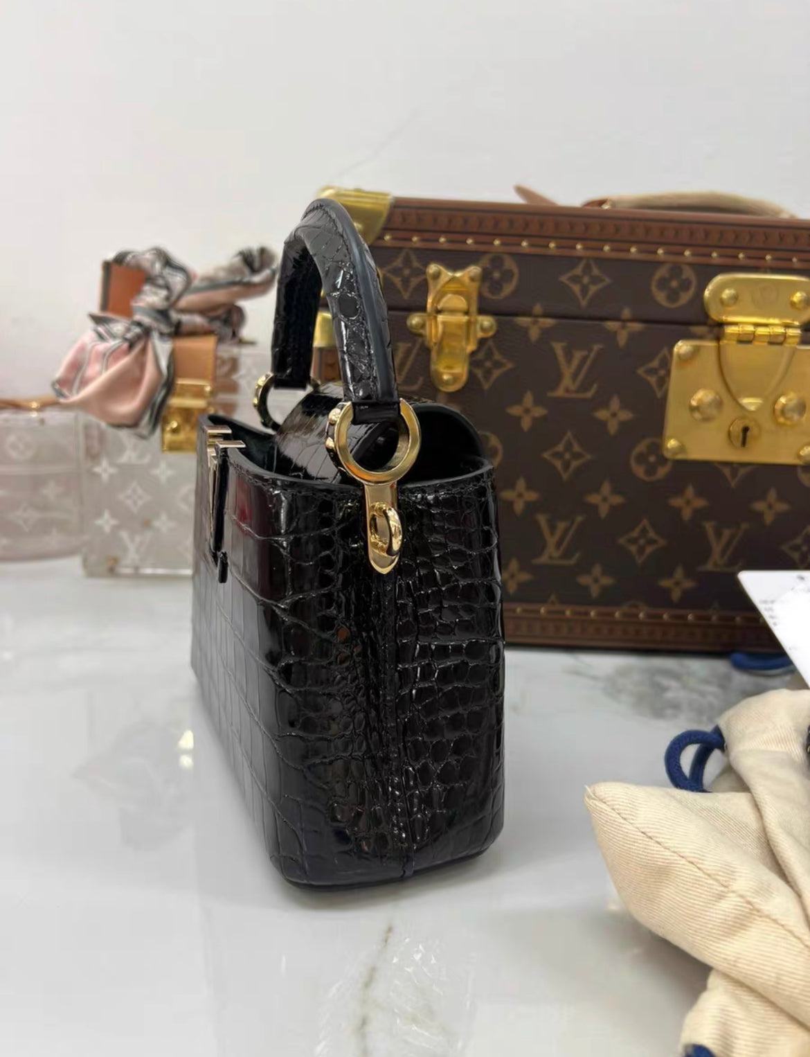 LOUIS VUITTON BLACK MINI CAPUCINES BB HANDBAG IN SHINY CROCODILE LEATHER WITH GOLD HARDWARE