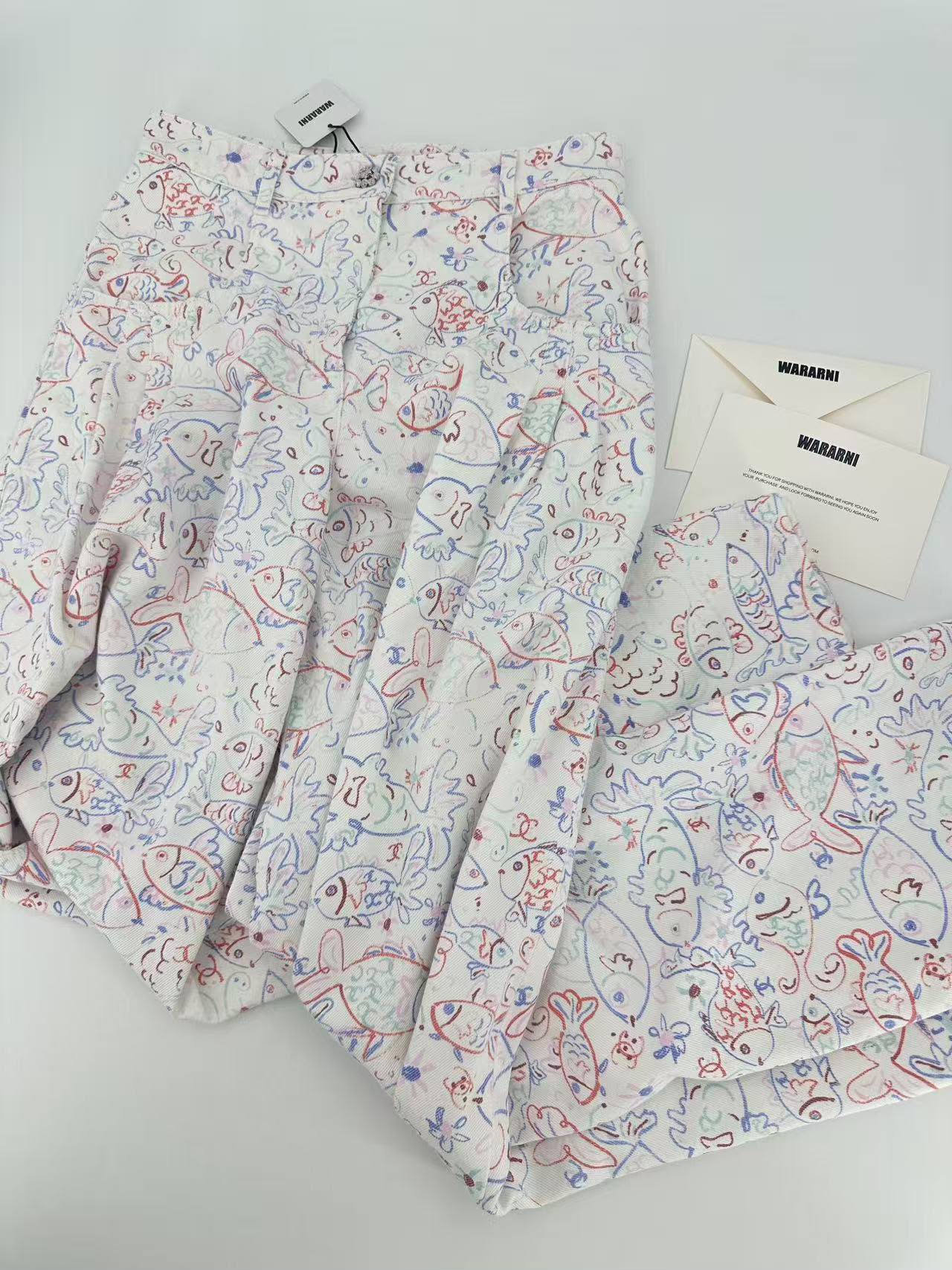 Chanel 25c white denim wide-leg pants with fish prints