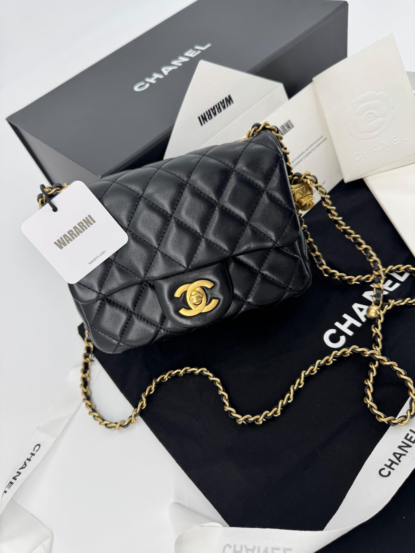 Chanel black mini flap bag with gold hardware