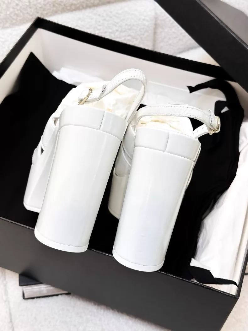 Chanel 23A white patent leather platform pumps