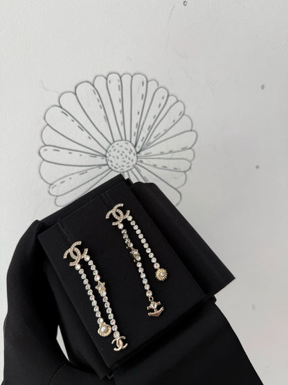 Chanel 25C shell star rhinestone tassel earrings