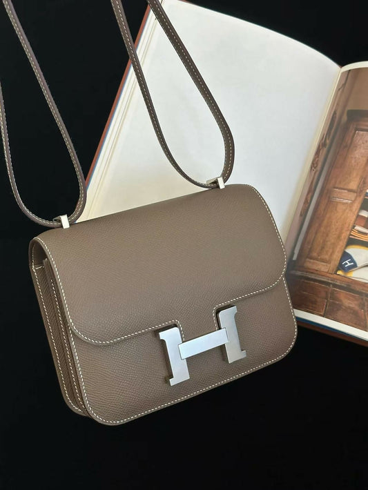 Hermès Constance shoulder bag in taupe grained leather with palladium H clasp and contrast stitching