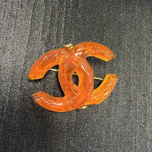 Chanel orange acrylic double C brooch