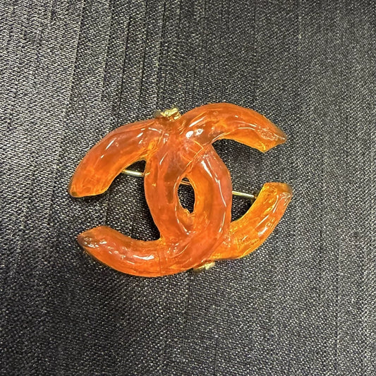 Chanel orange acrylic double C brooch