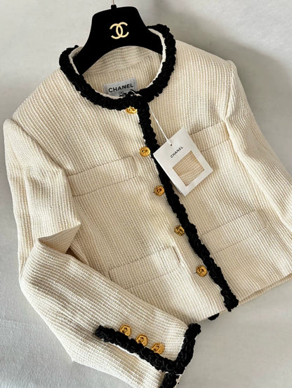 Chanel 26S ecru tweed jacket with black piping