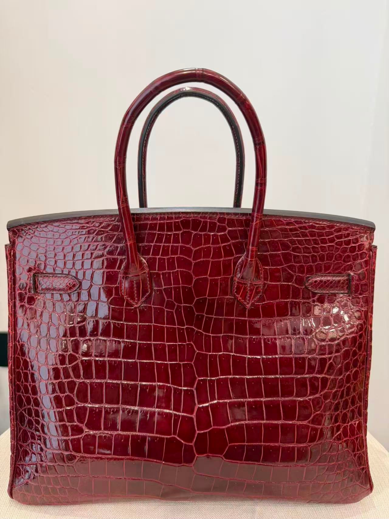 Rare Hermes Birkin 35 shiny Porosus Bordeaux Shiny Porosus Crocodile leather Gold hardware