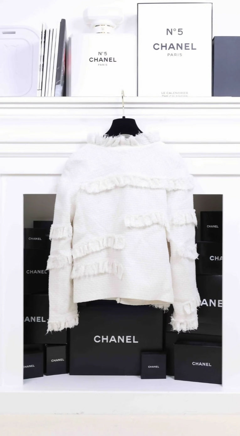 Chanel 2014 off white tweed jacket.