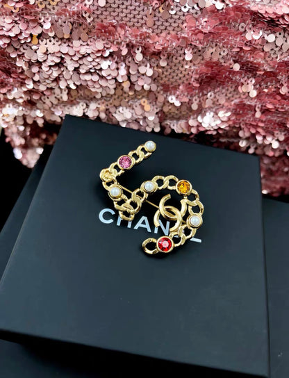 Chanel Autumn 2021 Number 5 Brooch With Faux Pearl and Colored Strass