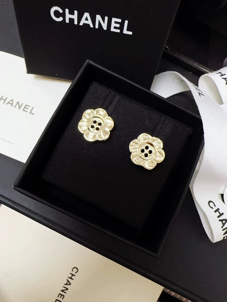 Chanel 25K gold flower button earrings