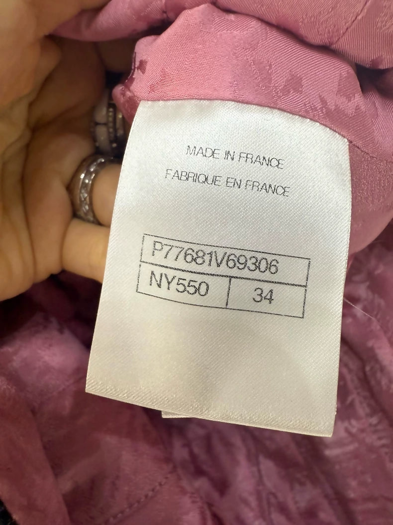 Chanel 24A long coat with black and white houndstooth pattern and pink silk lining