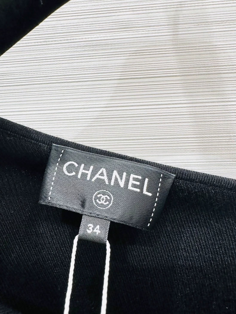 Chanel 25K black off-the-shoulder Bow top