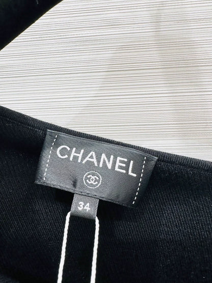 Chanel 25K black off-the-shoulder Bow top
