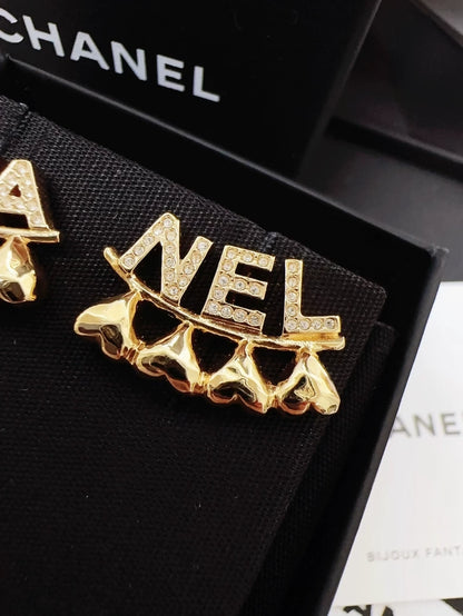Chanel 23P gold heart-shaped asymmetrical letter earrings