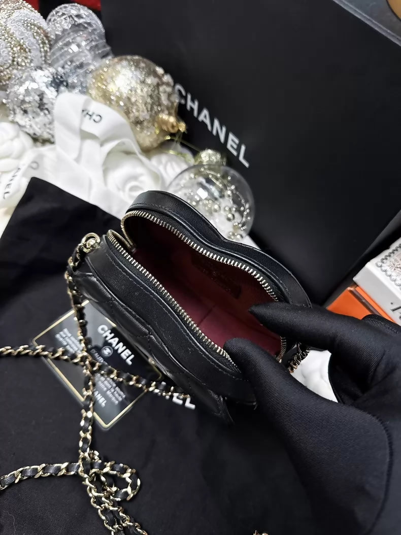 Chanel 22S black and gold quilted heart-shaped crossbody bag