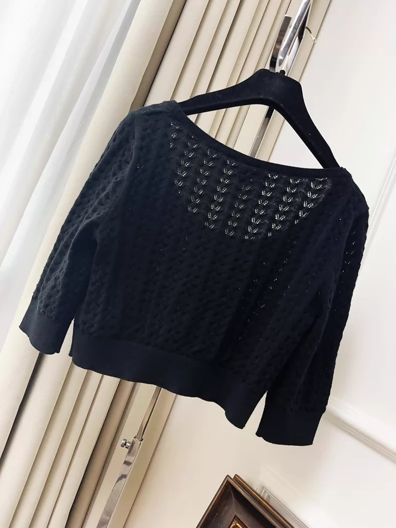 Chanel 24b black floral knit top with a large neckline