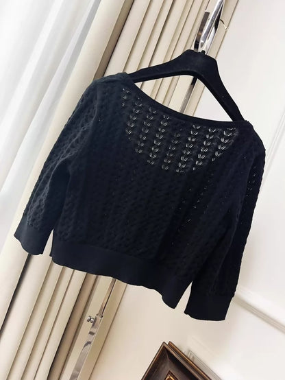 Chanel 24b black floral knit top with a large neckline