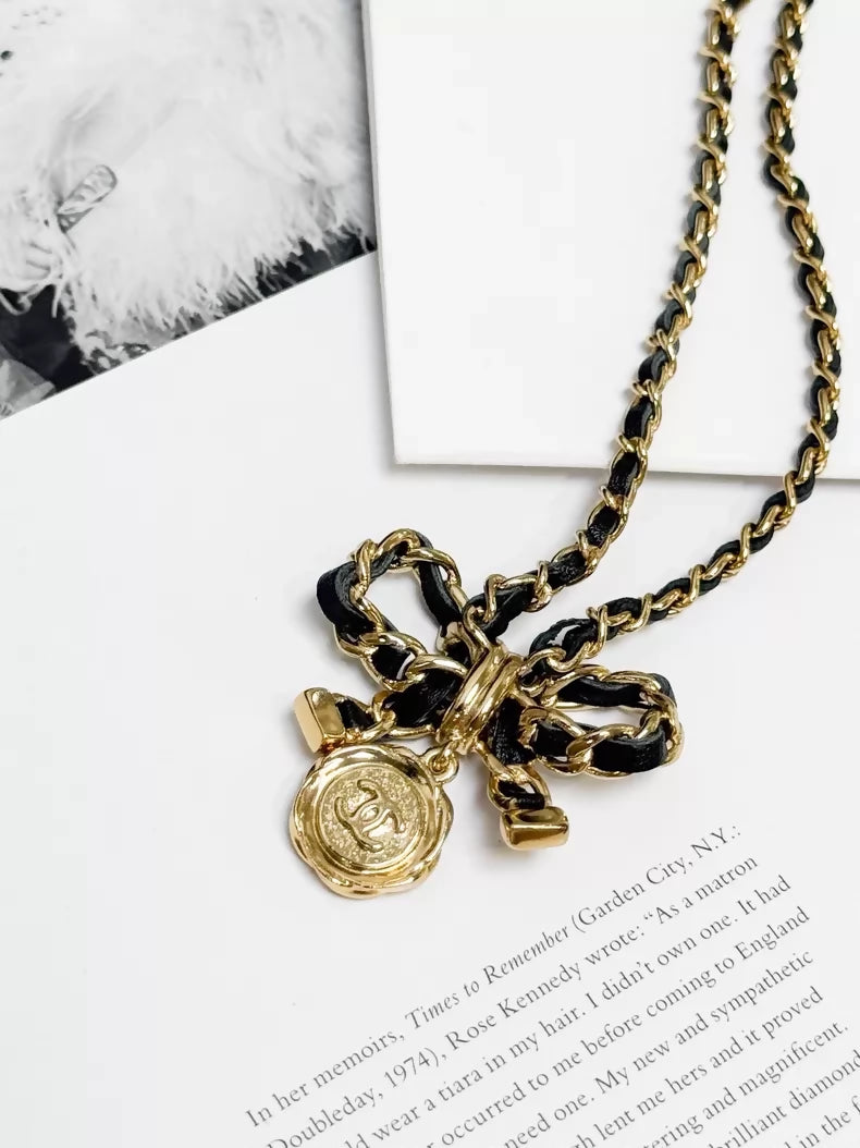 Chanel 22A  black and gold bow leather chain choker necklace