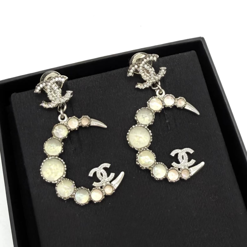 Chanel moon pendant earrings