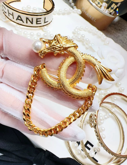 Chanel 24 dragon brooch