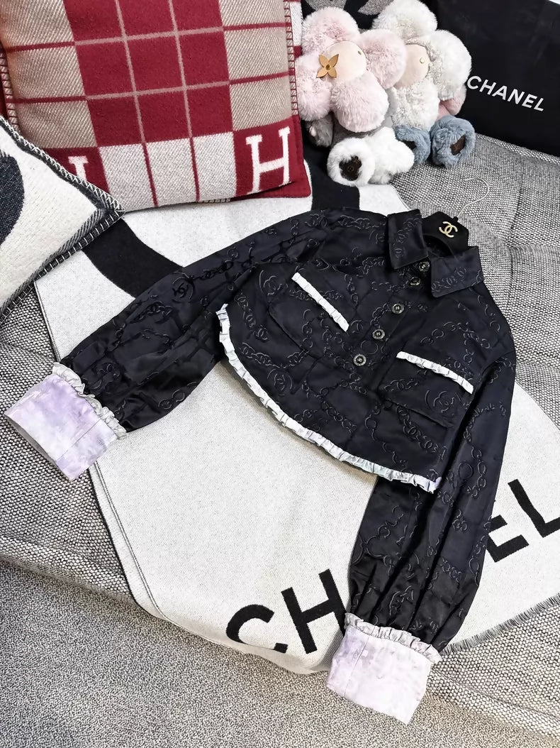 Chanel 22s black embossed double C logo jacket with purple gradient silk trim and two pockets