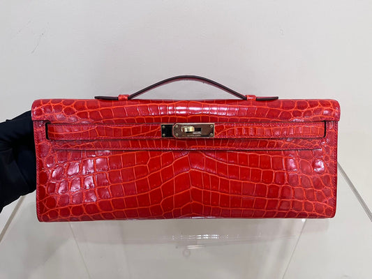 Hermes Kelly cut red shiny crocodile leather gold hardware