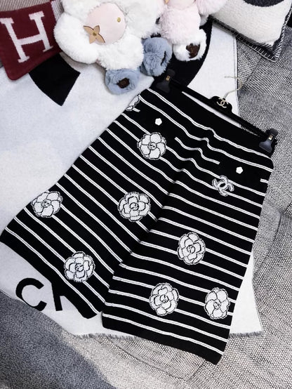 Chanel 23k black and white striped camellia double C logo knit shorts