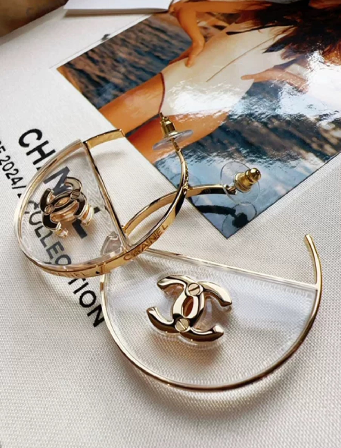 Chanel 23S gold double C transparent acrylic hoop earrings