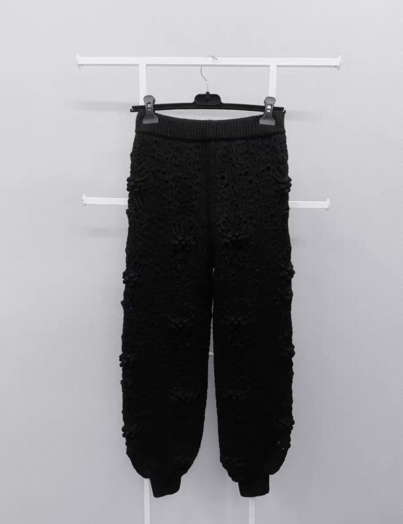 Chanel black camellia knit trousers