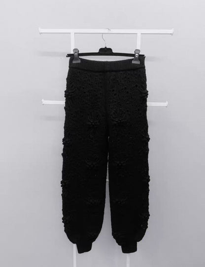 Chanel black camellia knit trousers