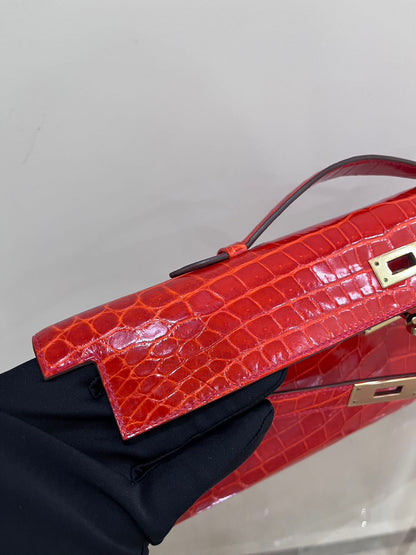 Hermes Kelly cut red shiny crocodile leather gold hardware