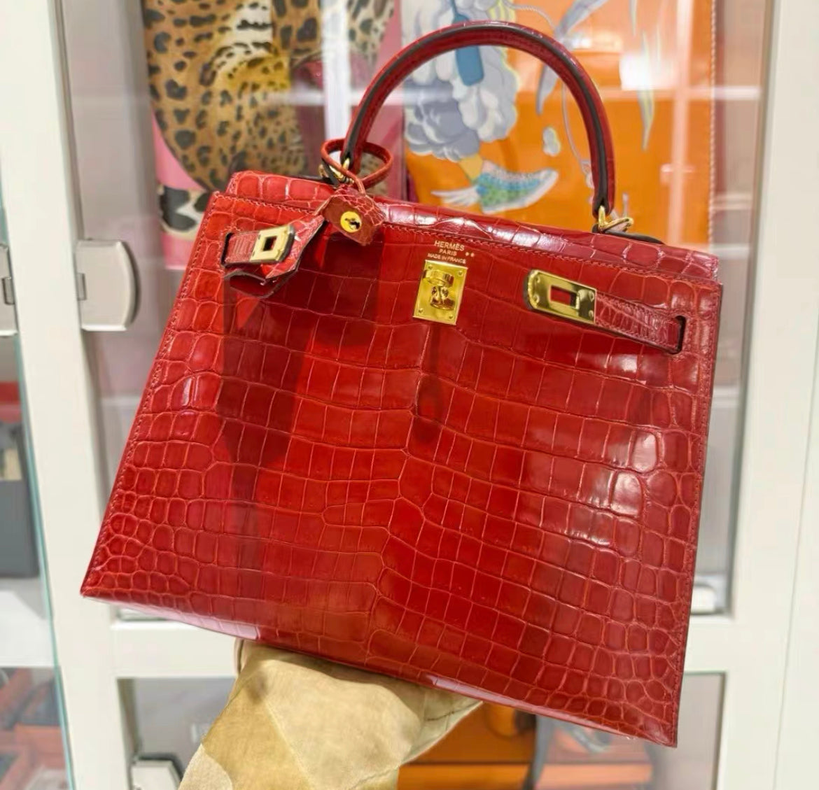 Hermès Kelly Sellier 25 Braise Shiny Porosus Crocodile Gold Hardware