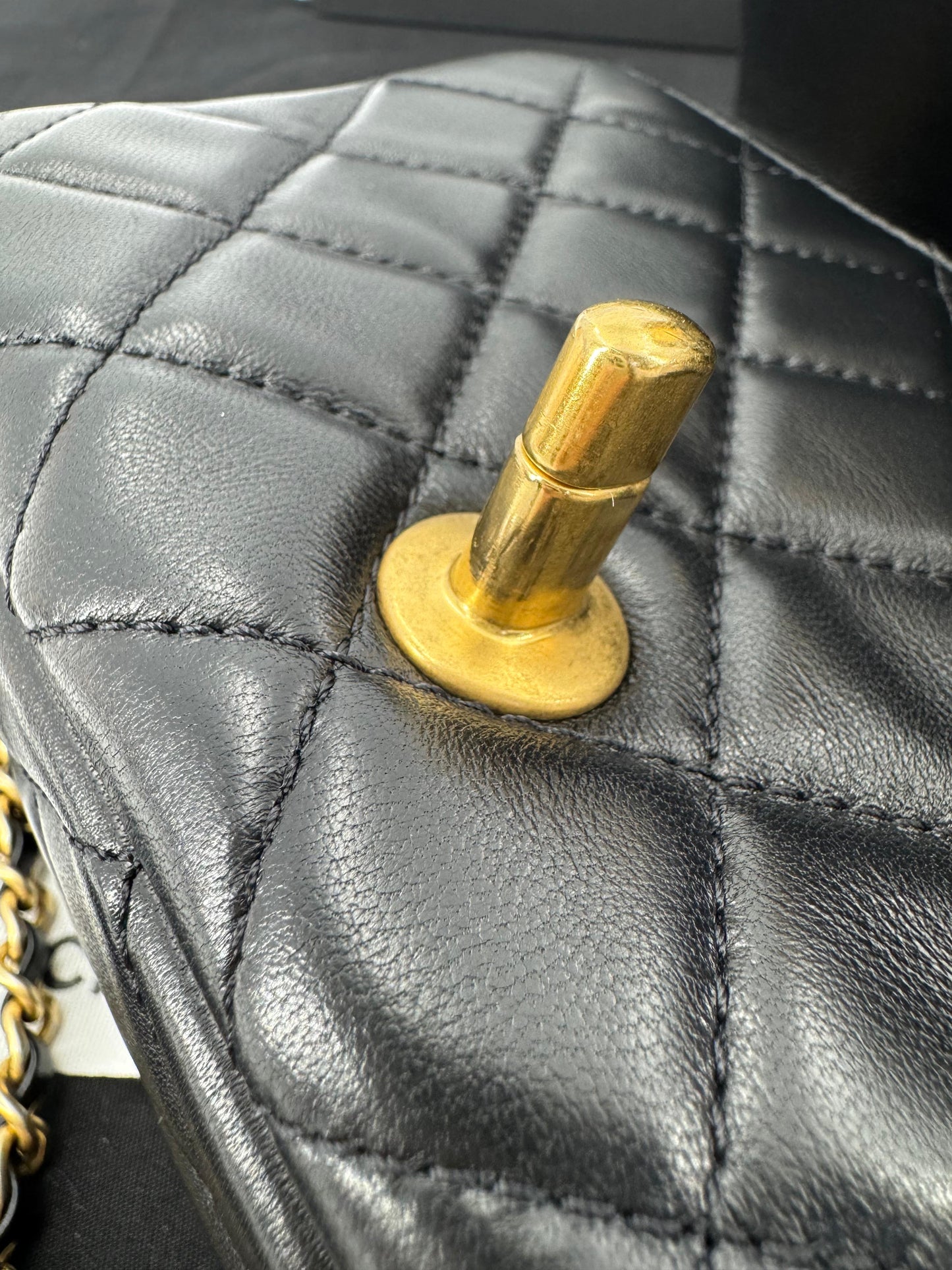 Chanel black mini flap bag with gold hardware