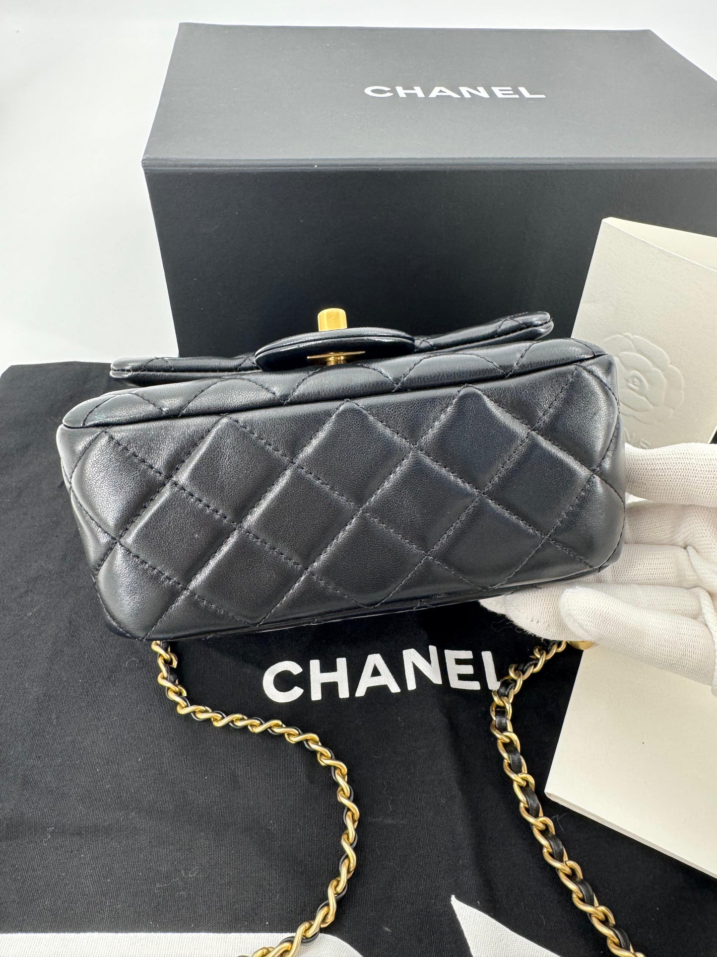Chanel black mini flap bag with gold hardware