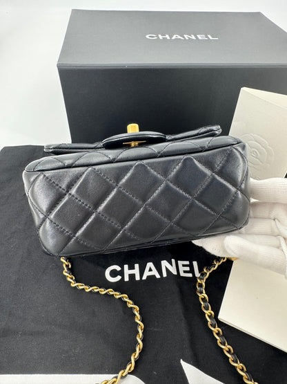 Chanel black mini flap bag with gold hardware