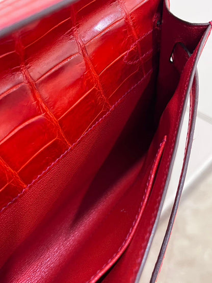 Hermes Kelly cut red shiny crocodile leather gold hardware