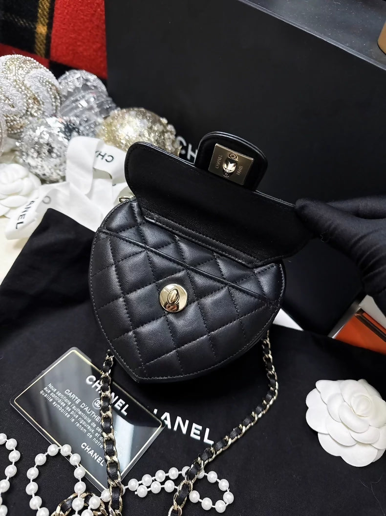 Chanel 22S black and gold quilted heart-shaped crossbody bag