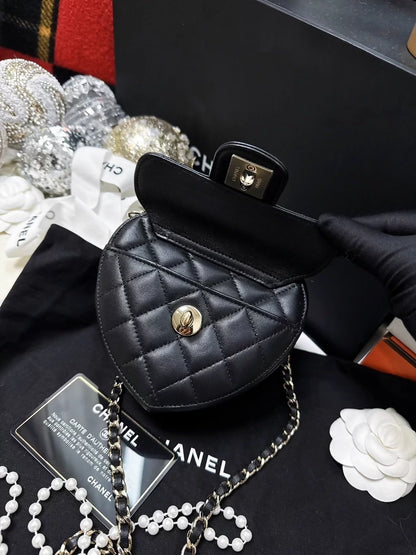 Chanel 22S black and gold quilted heart-shaped crossbody bag