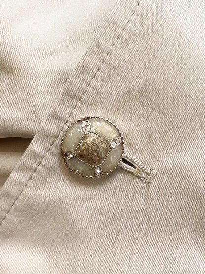Chanel 25B trench coat with CC logo print