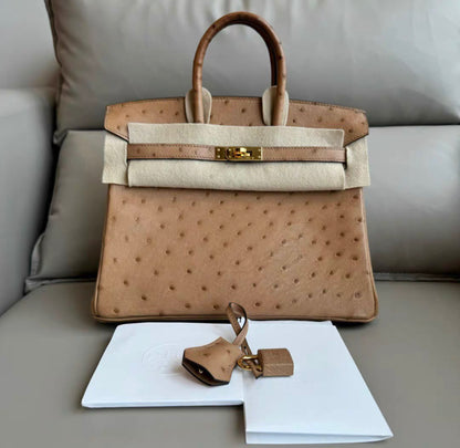 HERMÈS Ostrich Birkin 25 handbag in Chai with Gold hardware