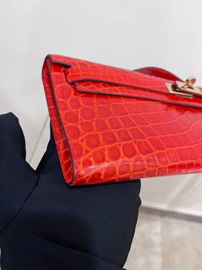 Hermes Kelly cut red shiny crocodile leather gold hardware