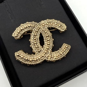 Chanel twist gold double C brooch