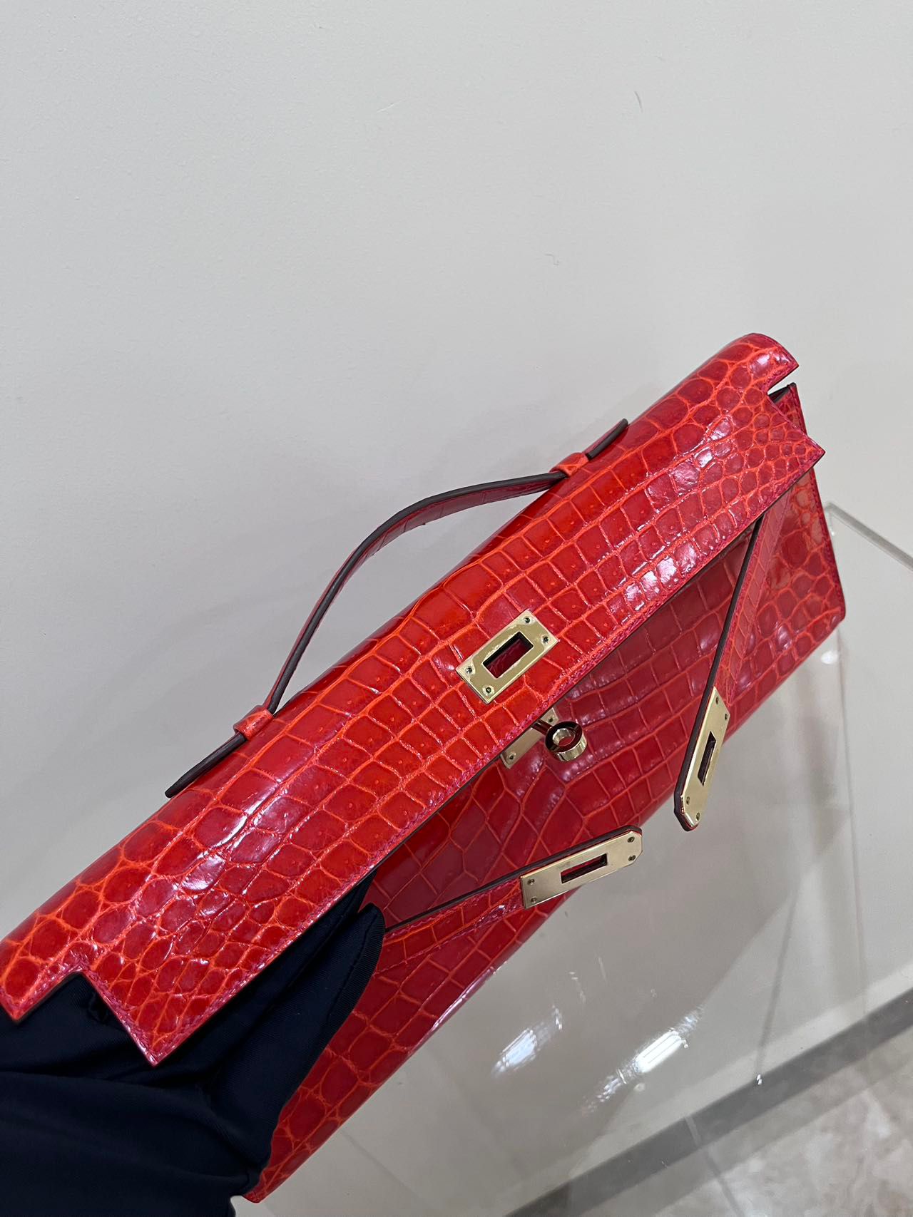 Hermes Kelly cut red shiny crocodile leather gold hardware