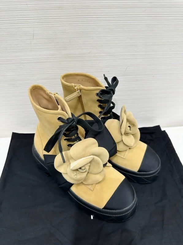 Chanel's popular black and suede camellia ankle boots with bow, size 36.5,