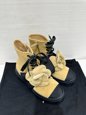 Chanel's popular black and suede camellia ankle boots with bow, size 36.5,