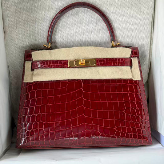 Hermes Kelly 28 Rouge Bordeaux shiny porosus crocodile leather gold hardware