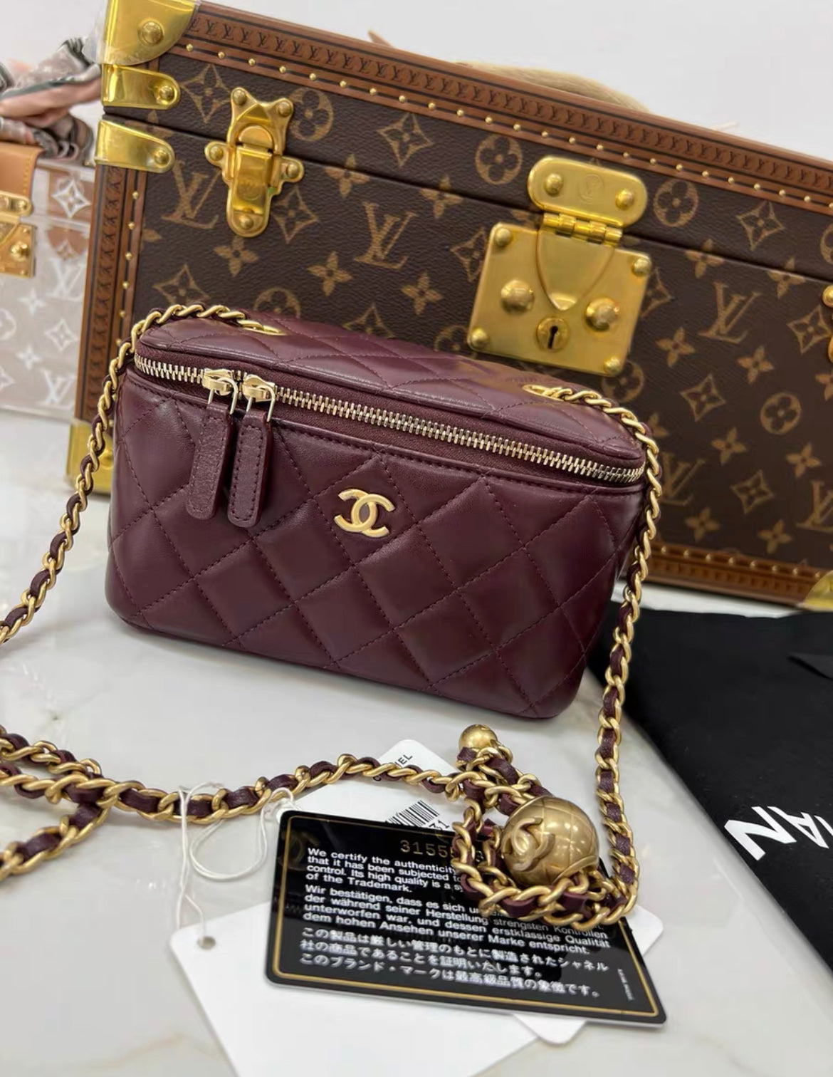 Chanel gold ball mini case chain bag in burgundy