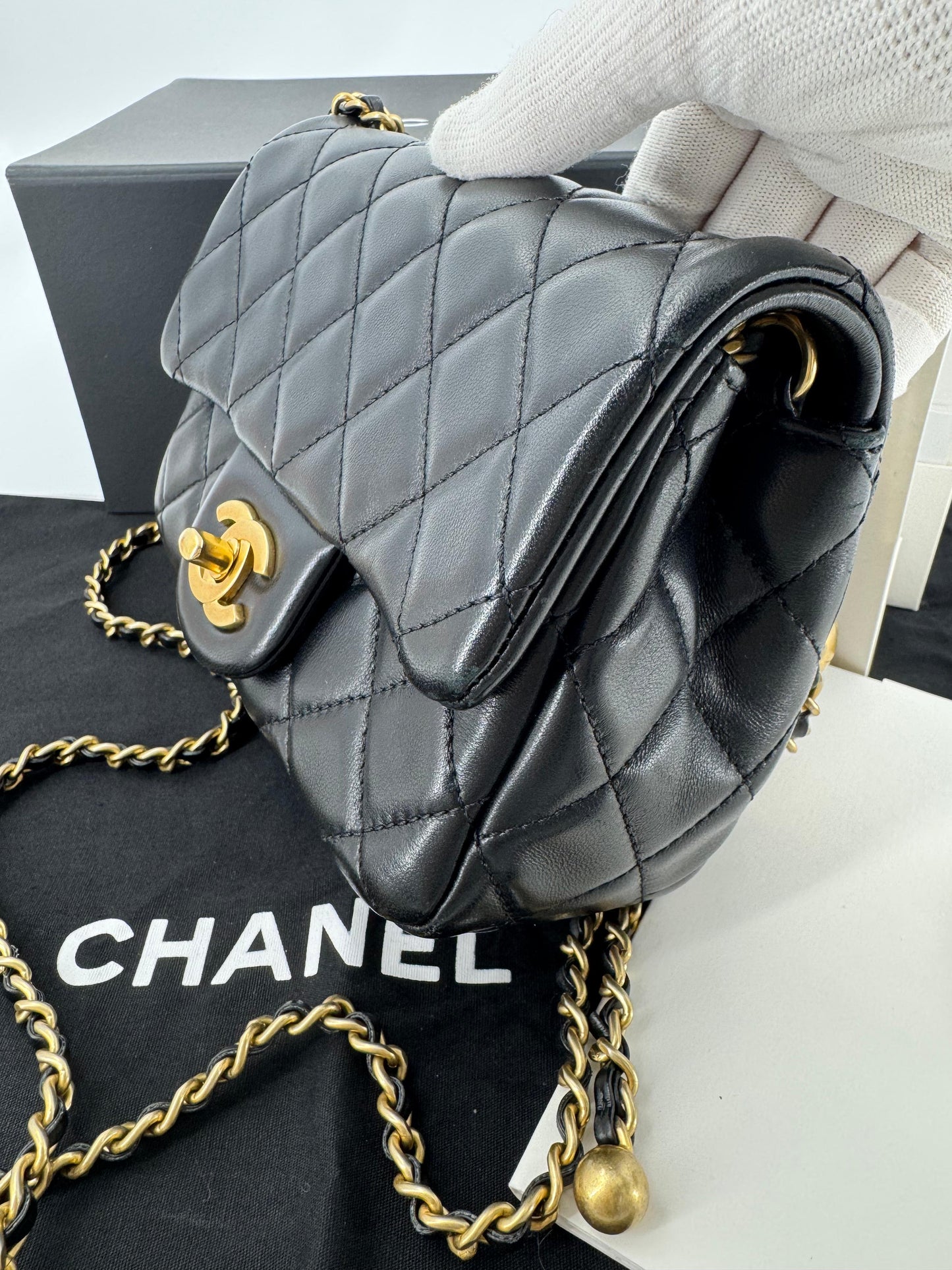 Chanel black mini flap bag with gold hardware