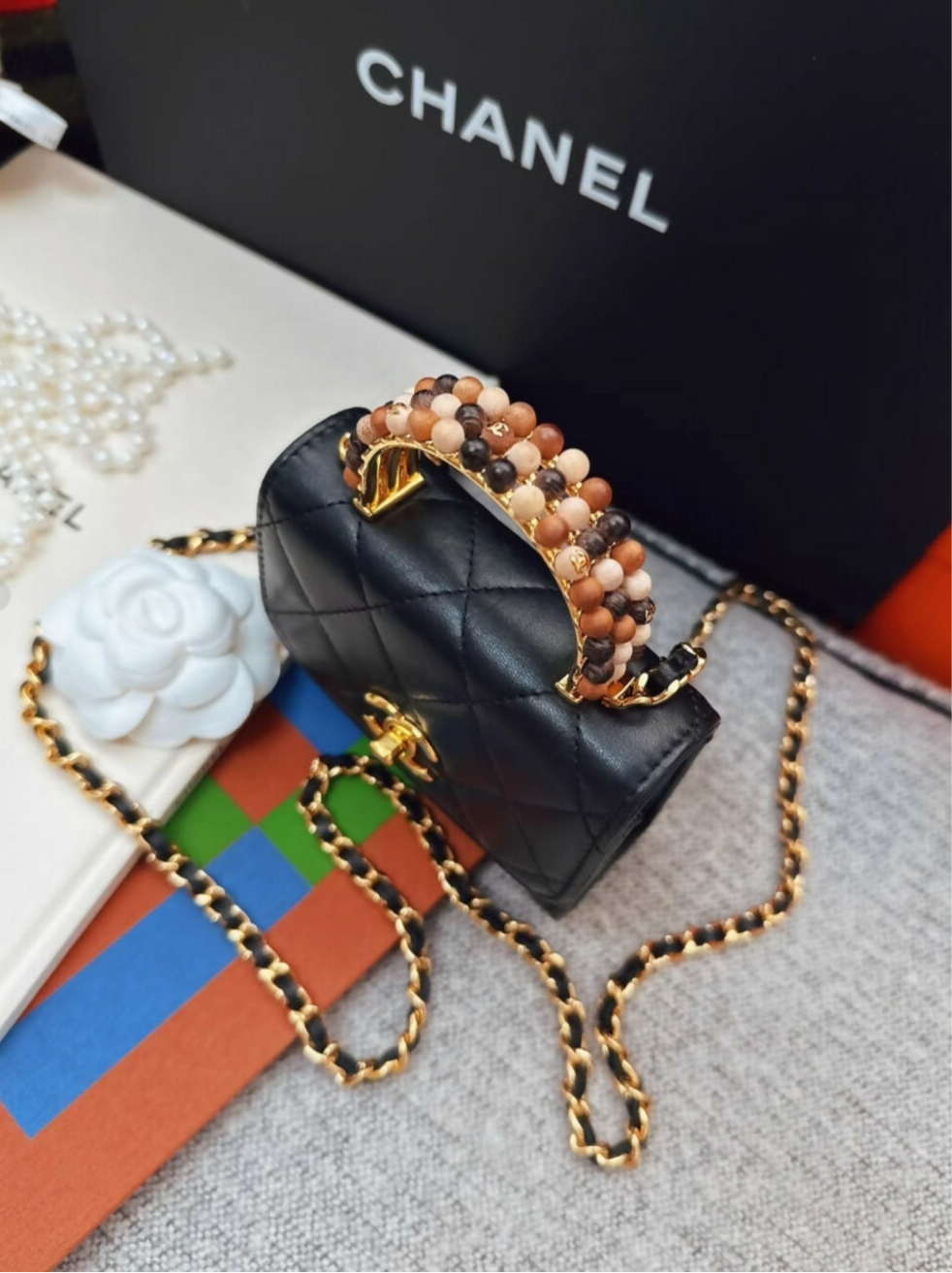 Chanel 23a Black Leather mini bag with gold top handle