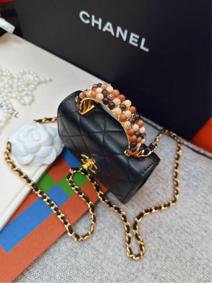 Chanel 23a Black Leather mini bag with gold top handle